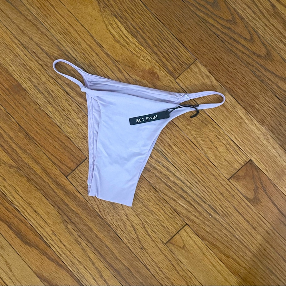 Set Swim XS cheeky bottom. Never worn, with tags. Lilac color
